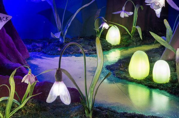 Selfridges Disney magical Christmas Alice in Wonderland window with handmade glowing paper flowers and glowing glass orbs